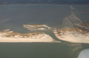 Aerial photos of the Wilderness breach. Atlantic Ocean foreground (below), Great South Bay in distance.