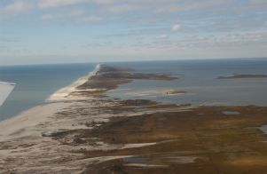 View looking west along Fire Island, Atlantic Ocean on left, Great South Bay on right.